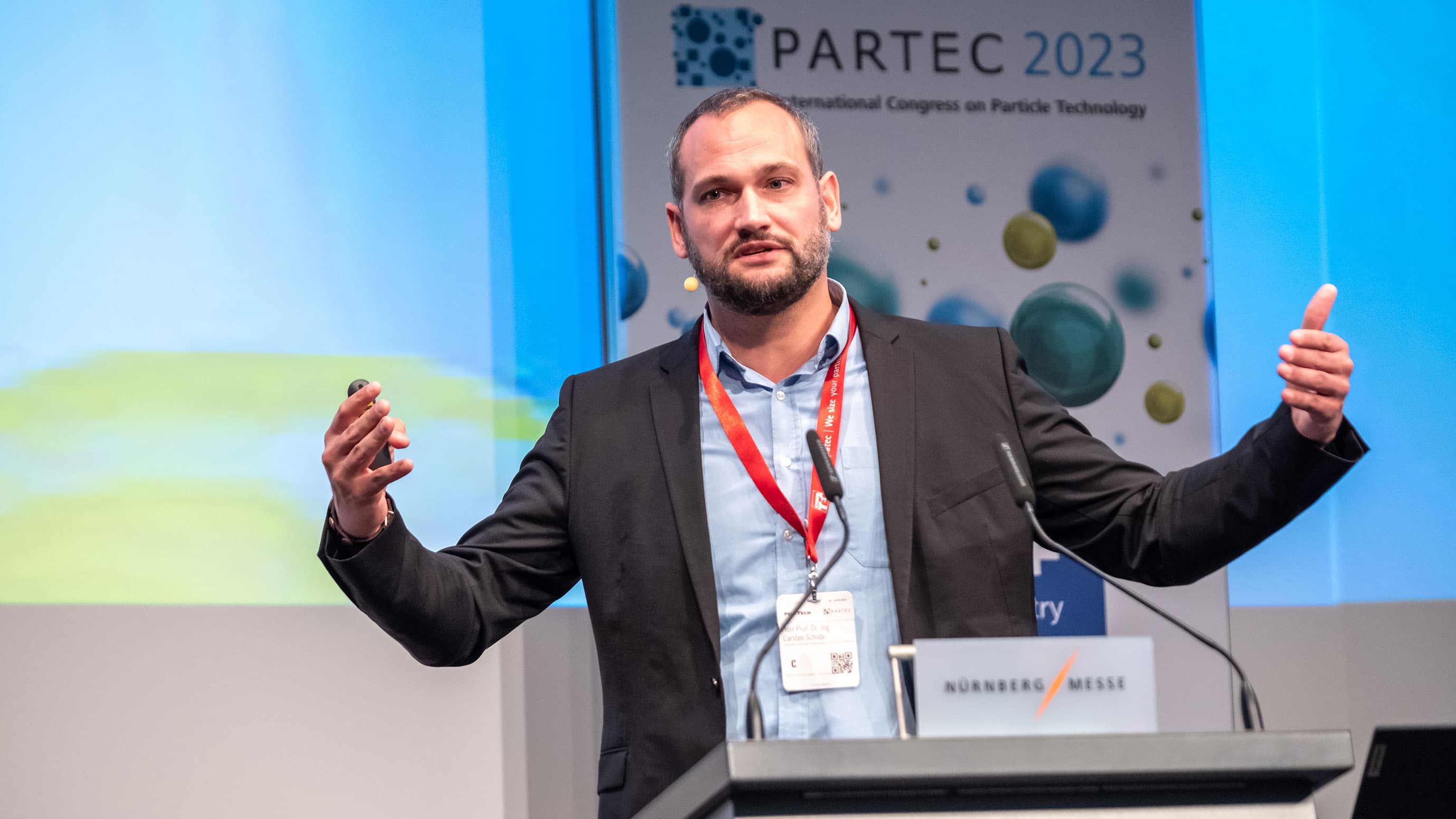 Expert explaining a topic on stage